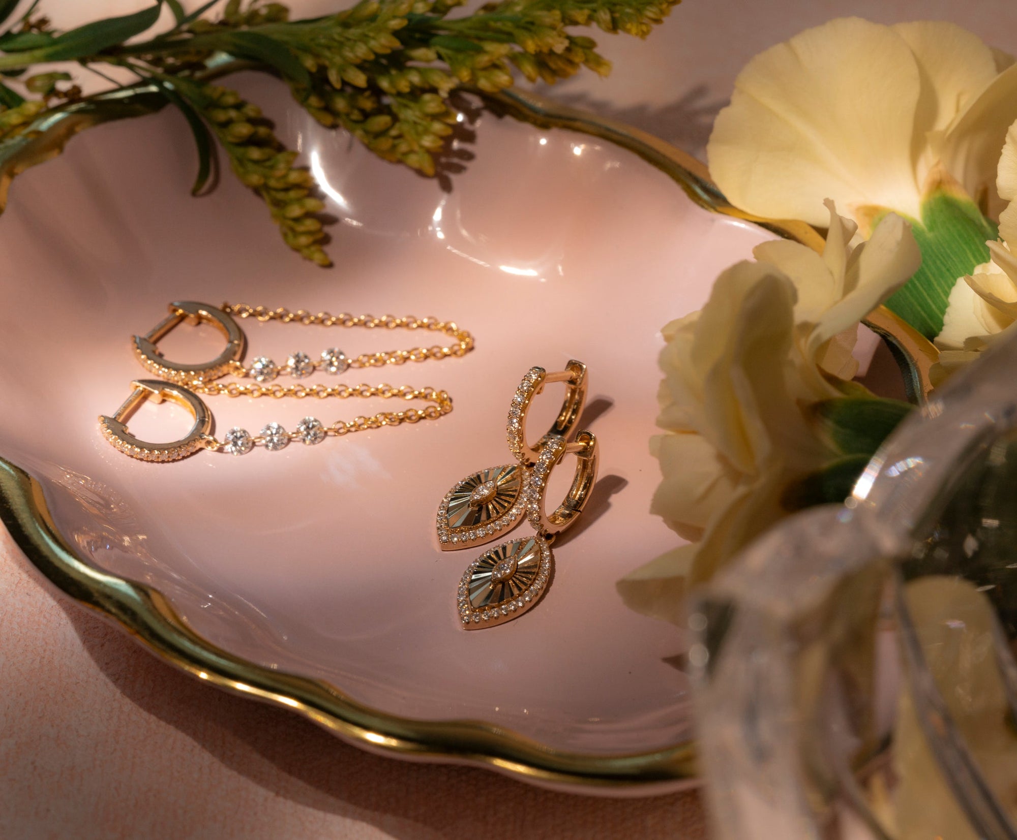 a grandmother, mother, and childs hands layered together with pieces of heirloom jewelry