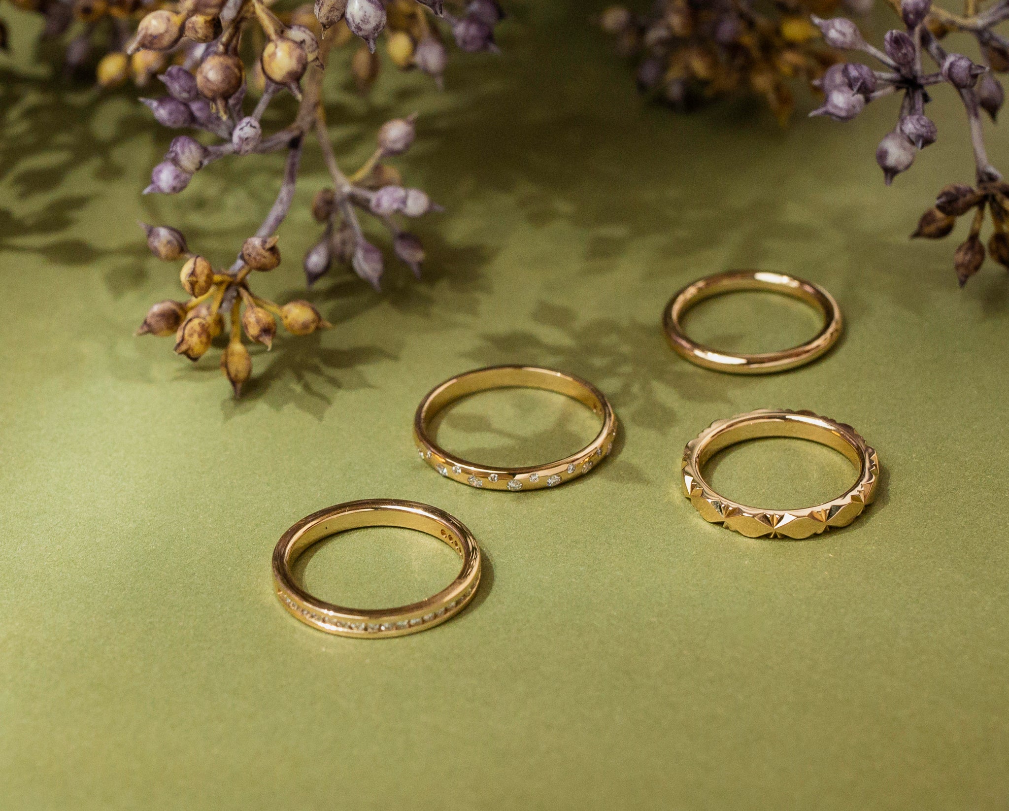 Four gold and diamond custom rings